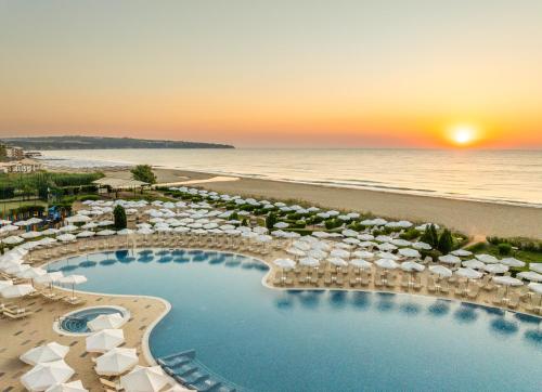 an aerial view of a resort with a pool and beach at Alua Helios Bay - All Inclusive in Obzor