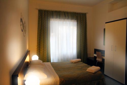 Postel nebo postele na pokoji v ubytování B&B Music