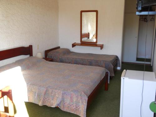 Postel nebo postele na pokoji v ubytování Hotel Yeruti