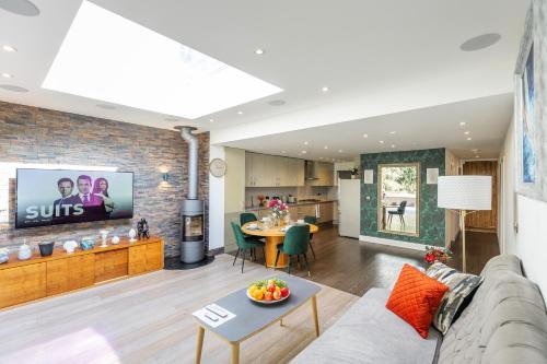 a living room with a couch and a table at Apartment in Guildford with Parking in Stoughton