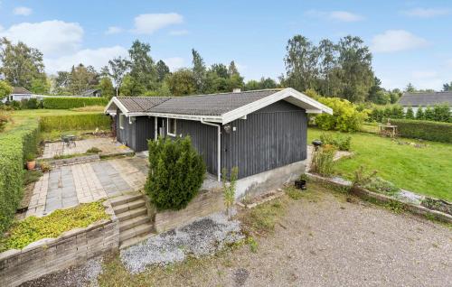 an aerial view of a house with a garden at 3 Bedroom Amazing Home In Skibby in Skibby