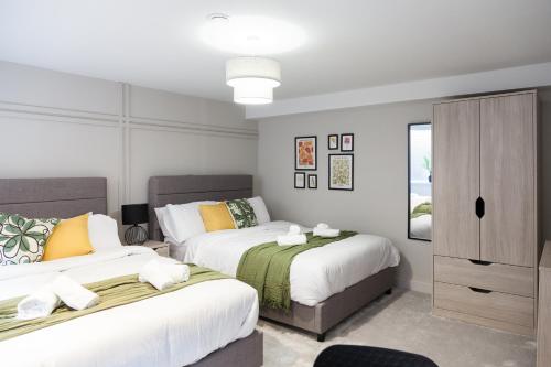 Ένα ή περισσότερα κρεβάτια σε δωμάτιο στο Somers Suites Apartments