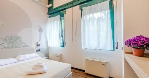 Ένα ή περισσότερα κρεβάτια σε δωμάτιο στο Casa Temporanea