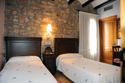 Posteľ alebo postele v izbe v ubytovaní Hotel Restaurant Verdià