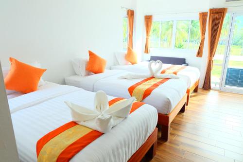 Cama o camas de una habitación en Pranee Amata