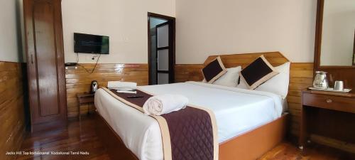 Postel nebo postele na pokoji v ubytování The Jacks Hilltop Resort Kodai