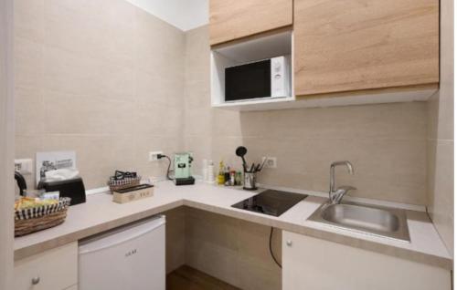 Kuchyň nebo kuchyňský kout v ubytování Pompei Luxury Suite