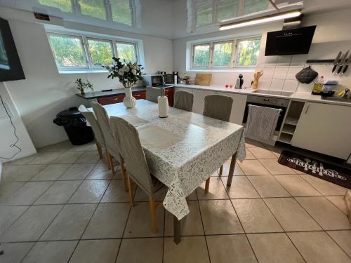 a kitchen with a table and chairs in a room at Casa de Rainer Copenhagen Room 9 in Copenhagen