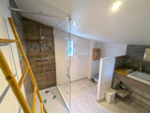 a bathroom with a shower and a sink at Le Panorama des Alpilles in Aureille
