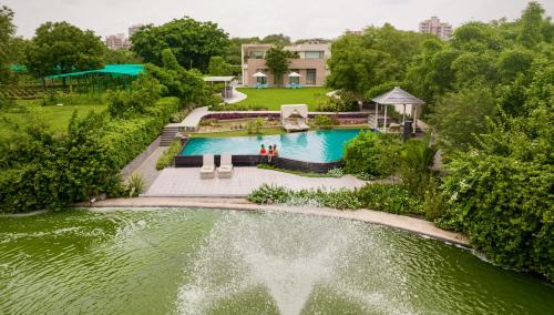 an aerial view of a swimming pool in a house at Karma Lakelands Golf Resort & Residences in Gurgaon