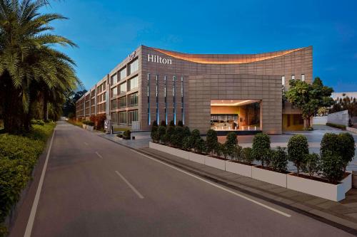 a rendering of the hilton hotel on a street at Hilton Bangalore Embassy GolfLinks in Bengaluru