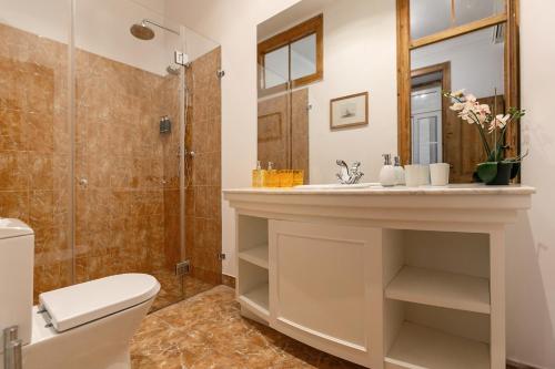 a bathroom with a sink and a shower at Lisbon Rentals Real in Lisbon