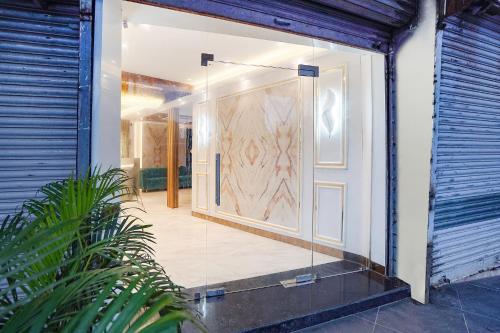 an open door of a house with a glass at FabHotel Well Back - Nr BKC in Mumbai
