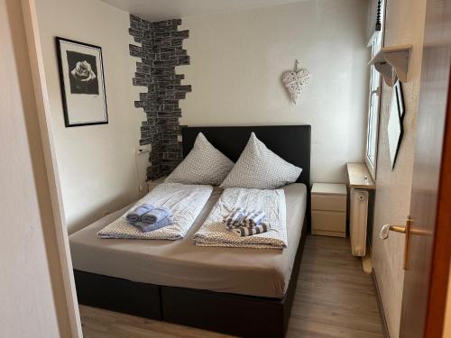 Giường trong phòng chung tại Haus Uthlande Ferienwohnung Küstenperle