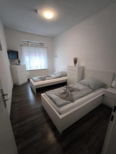 a bedroom with two beds in a room at Andrews Ferienwohnungen in Tangermünde