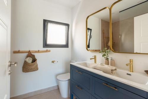 a bathroom with a sink and a mirror at Villa With Privat Saltwater Pool in Benalmádena