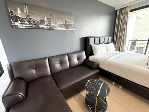 Ένα ή περισσότερα κρεβάτια σε δωμάτιο στο Apartments at The Bliss Condo by Lofty