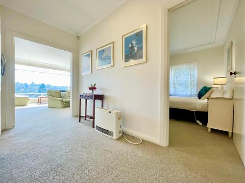 a room with a bedroom with a bed and a window at Scarlett's Place in Blackheath