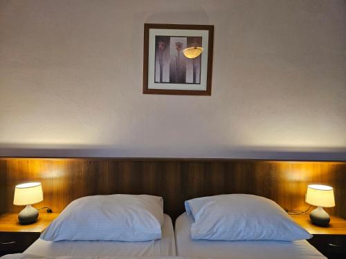 Postel nebo postele na pokoji v ubytování Hotel Trim