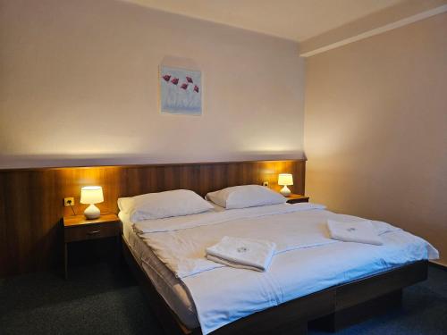 Postel nebo postele na pokoji v ubytování Hotel Trim