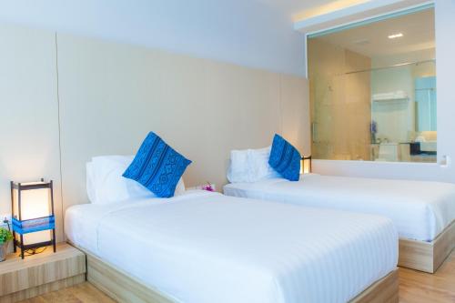 Cama o camas de una habitación en Grand Vista Hotel Chiangrai