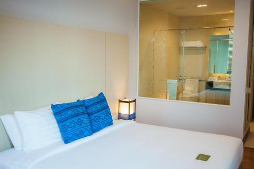 Cama o camas de una habitación en Grand Vista Hotel Chiangrai
