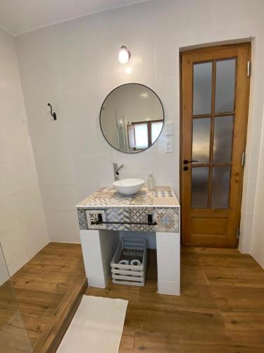 a bathroom with a sink and a mirror at Posada del Milagro in Salta