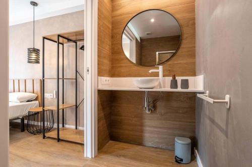 a bathroom with a sink and a mirror at Cozy Ocean View Cala Crancs Flat in Salou