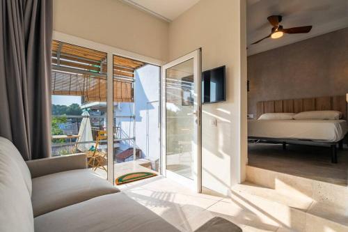 a bedroom with a bed and a view of a balcony at Cozy Ocean View Cala Crancs Flat in Salou