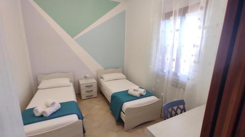 Ένα ή περισσότερα κρεβάτια σε δωμάτιο στο Villetta Basso