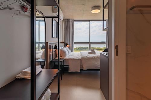 Cama o camas de una habitación en Spot Jurere sofisticación junto al mar - SPJ's
