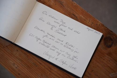 a piece of paper with writing on it on a table at Weingut Stuck in Appiano sulla Strada del Vino