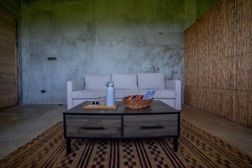 a living room with a white couch and a table at Izustarri in Burgos