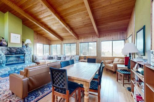 a living room with a table and a couch at Sea View in Sea Ranch