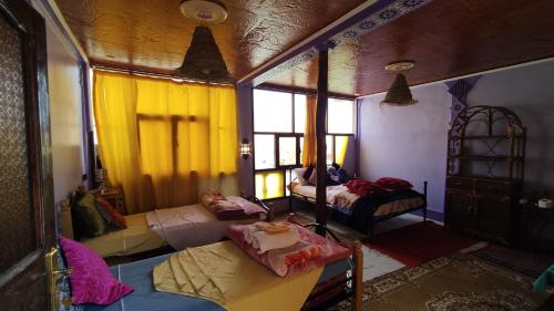Postel nebo postele na pokoji v ubytování Guesthouse Panorama Todra