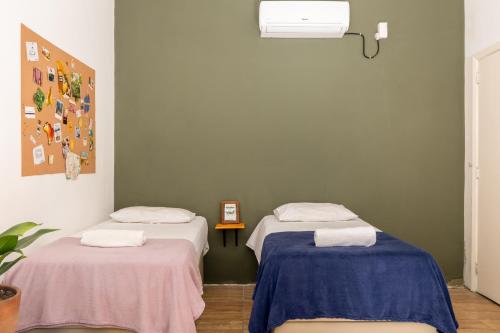 Postel nebo postele na pokoji v ubytování Chez Zany Boutique Hostel - Santa Teresa