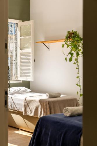 Postel nebo postele na pokoji v ubytování Chez Zany Boutique Hostel - Santa Teresa