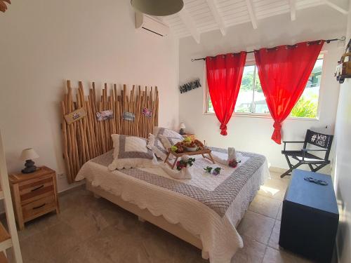 Postel nebo postele na pokoji v ubytování Le Paradis