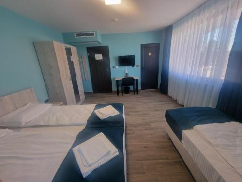 Ένα ή περισσότερα κρεβάτια σε δωμάτιο στο Хостел Стадиона