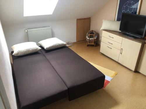 Postel nebo postele na pokoji v ubytování Ferienwohnung Buchbergblick