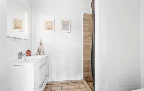 a white bathroom with a sink and a shower at 4 Bedroom Gorgeous Home In Vestervig in Vestervig