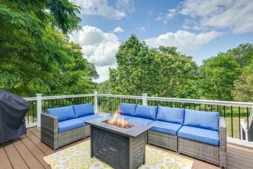 a patio with two chairs and a table with a fire pit at Front Royal Retreat on 3 Acres with Mtn Views! in Front Royal