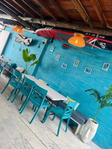 a table and chairs in front of a swimming pool at Itaca Eco House in Playa Blanca