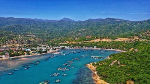 an aerial view of a harbor with boats in the water at Dan's house in Kinh Dinh