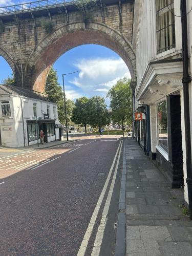 an archway over an empty street under a bridge at The Bridge Hotel in Durham