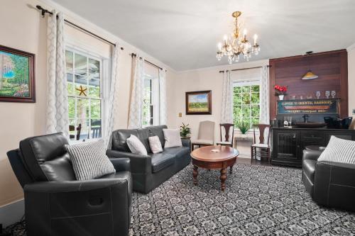 a living room with a couch and chairs and a table at Shopping Restaurants 6 mins to Beach AC in Yarmouth