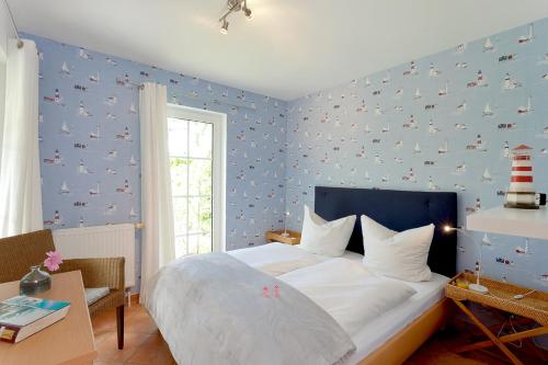 Ένα ή περισσότερα κρεβάτια σε δωμάτιο στο FeWo 43 1, Heideweg 3 a