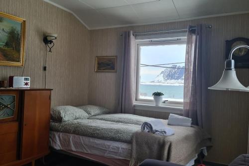 Ένα ή περισσότερα κρεβάτια σε δωμάτιο στο Isabella`s room - Lofoten