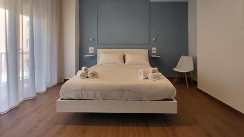 a bedroom with a large bed with towels on it at Latte e Letto in Avellino