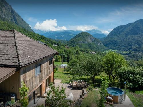 an image of a house with a view of mountains at La Ferme des Artistes - OVO Network in Mieussy